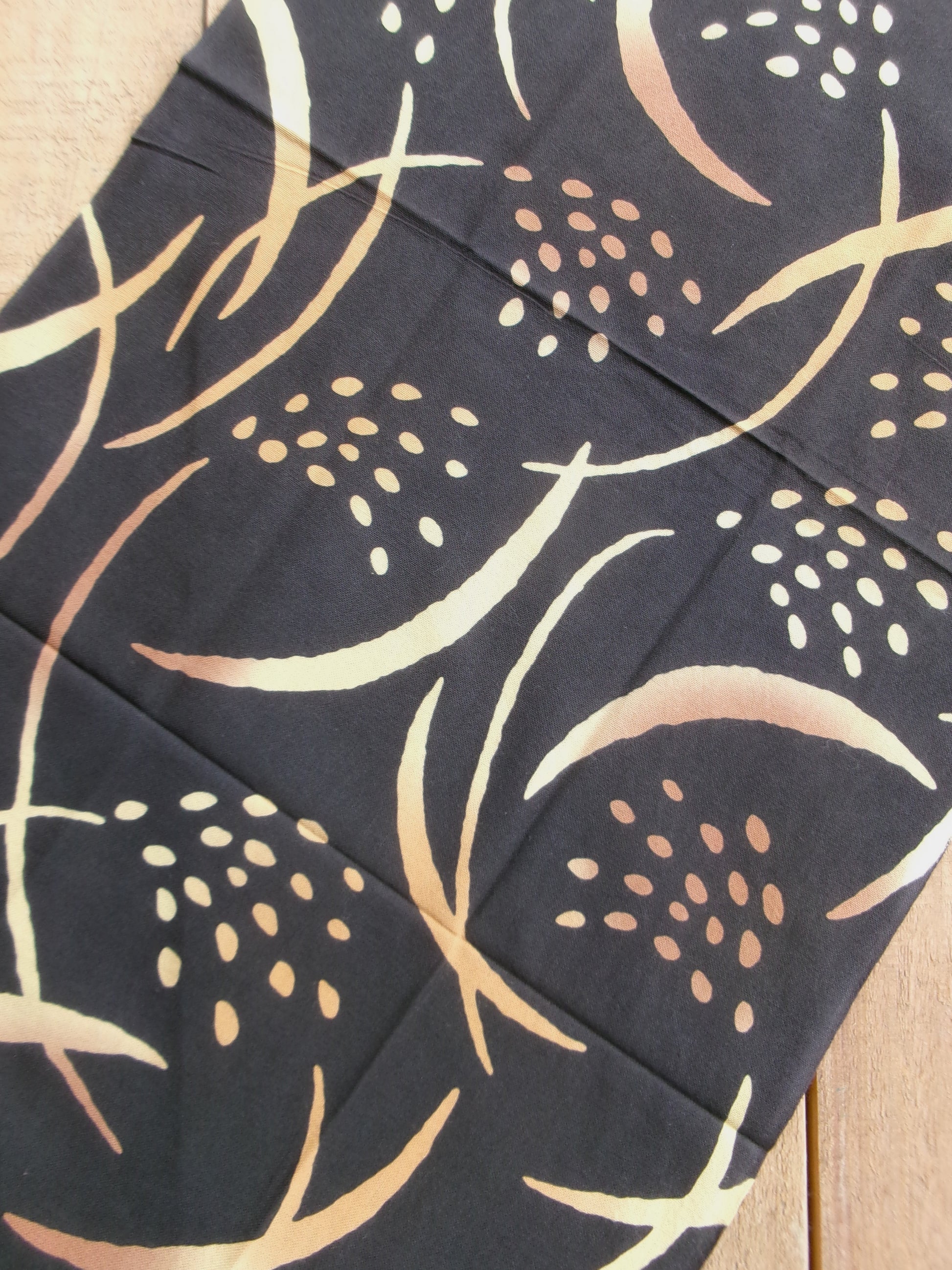 Japanese tenugui towel with golden rice plant design by Kamawanu, featuring traditional textile art and vibrant gold and blue colors.