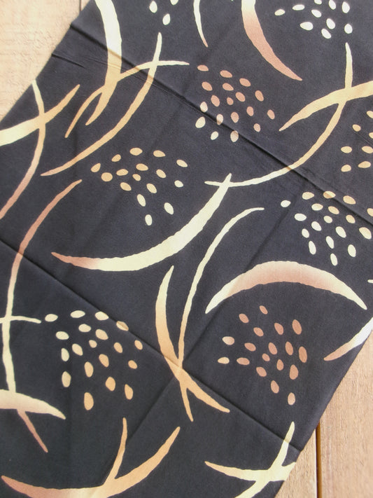 Japanese tenugui towel with golden rice plant design by Kamawanu, featuring traditional textile art and vibrant gold and blue colors.