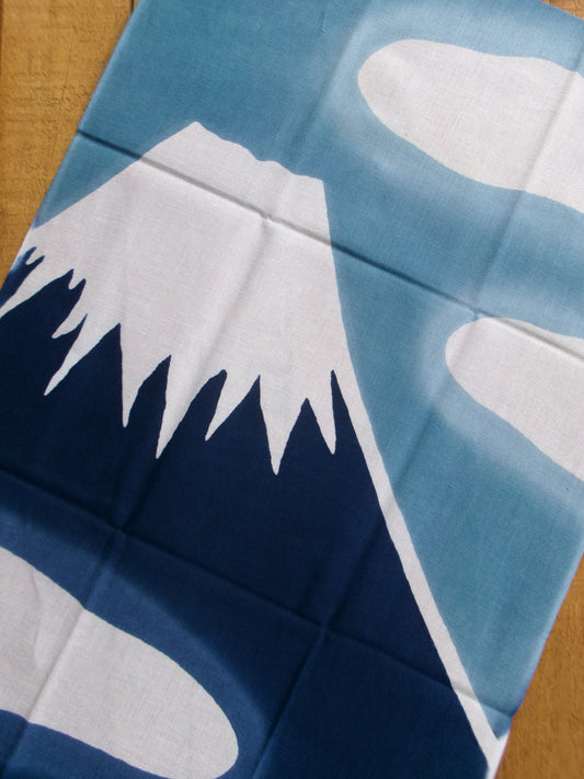 Japanese tenugui towel featuring Fuji Mountain and hot spring imagery, crafted by Kamawanu, showcasing traditional design and craftsmanship.