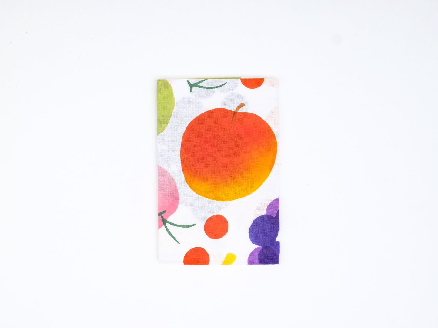 Colorful Japanese tenugui cloth featuring a vibrant fruit pattern by Kamawanu, displayed flat with detailed fruit illustrations.