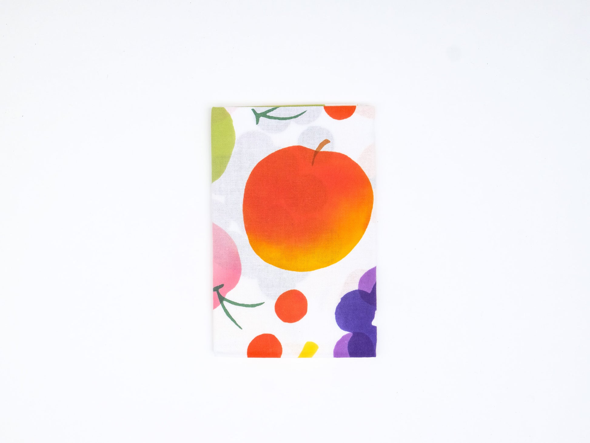 Colorful Japanese tenugui cloth featuring a vibrant fruit pattern by Kamawanu, displayed flat with detailed fruit illustrations.