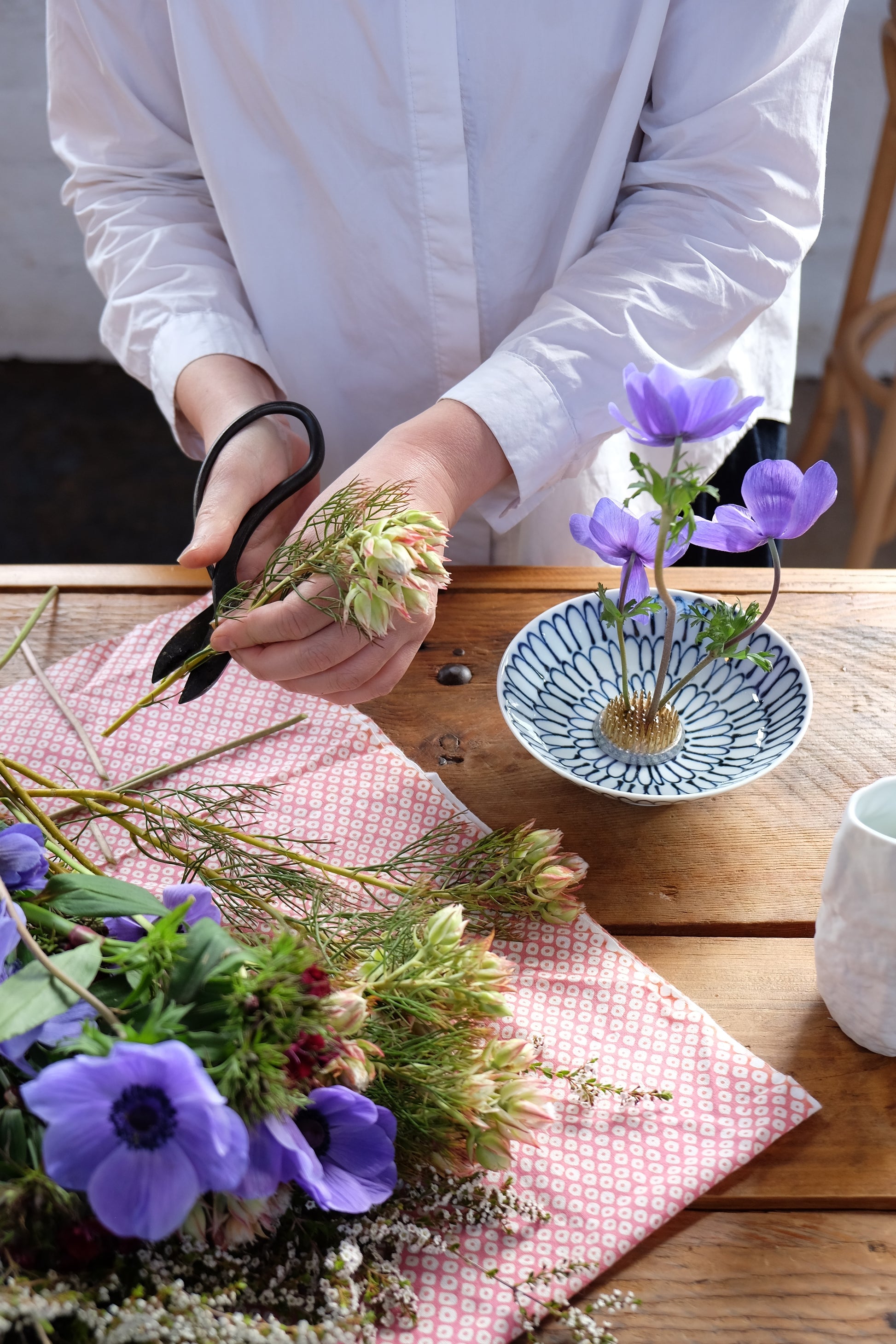 CIBI Ikebana set with shallow tea bowl and floral foam for traditional Japanese flower arranging displayed at an exhibition.