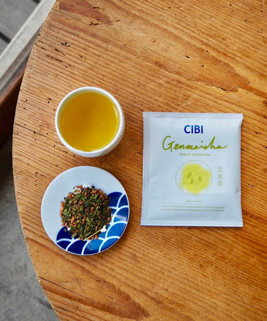 Organic Genmaicha drip bag from CIBI TOKYO STORE, showing a tea bag with roasted rice and green tea leaves inside.