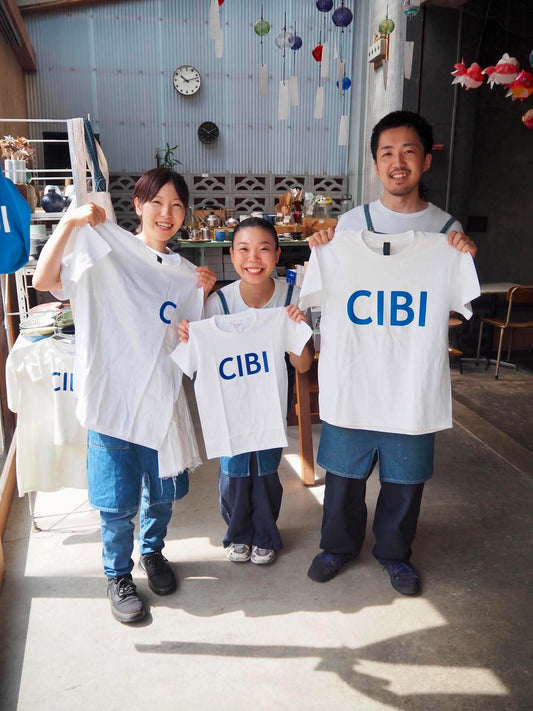 CIBI TOKYO STORE CIBI T-shirt in black with white logo, crew neck, short sleeves, casual fit, displayed flat on white background.