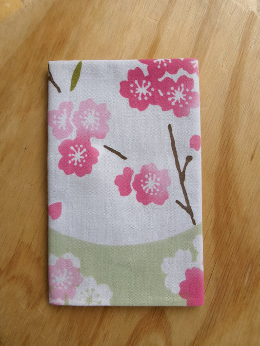 Japanese tenugui towel with cherry blossom and oboro pattern by Kamawanu, featuring intricate sakura and traditional design details.