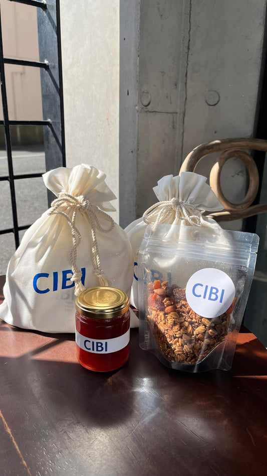 CIBI TOKYO STORE strawberry jam and granola gift set in a fabric pouch, featuring jars of jam and a bowl of granola with strawberries.