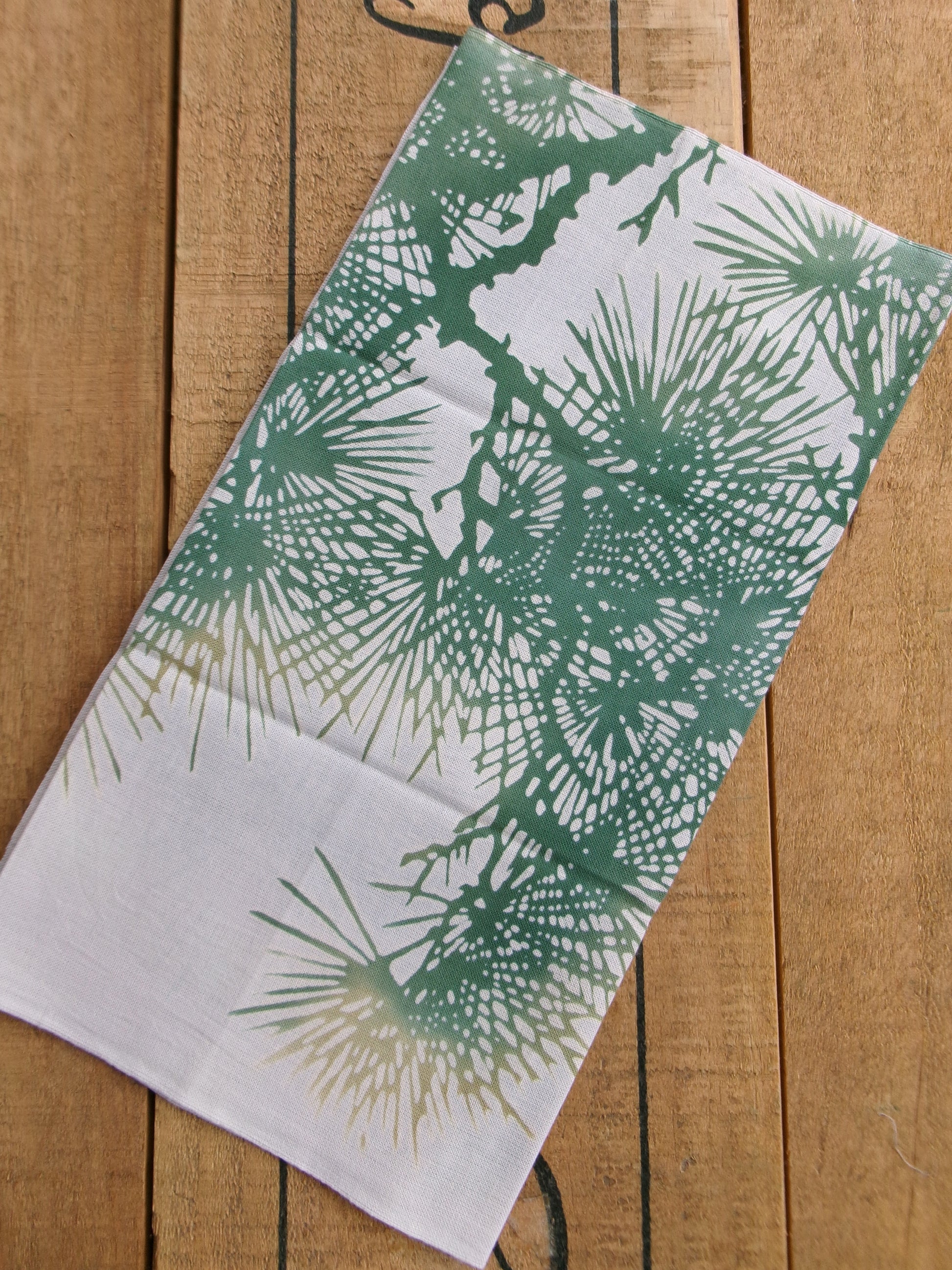 Traditional tenugui hand towel by Kamawanu featuring a blurred old pine tree design with soft, muted colors.