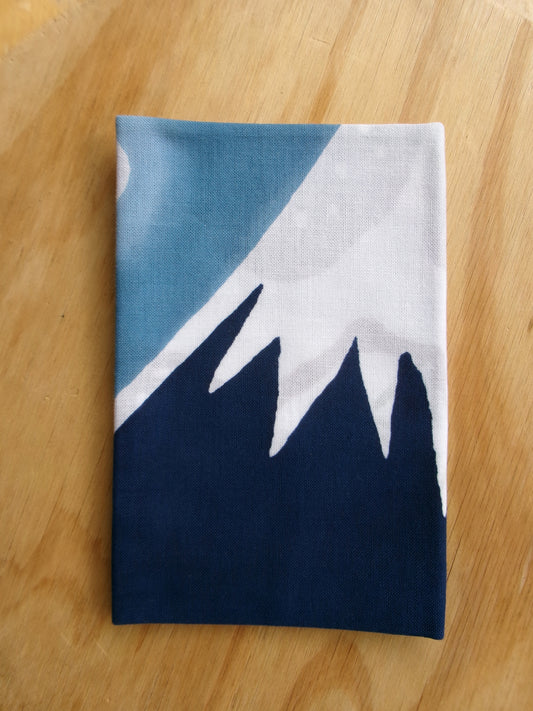 Traditional Japanese tenugui towel featuring a scenic design of Mount Fuji and hot springs, by Kamawanu.