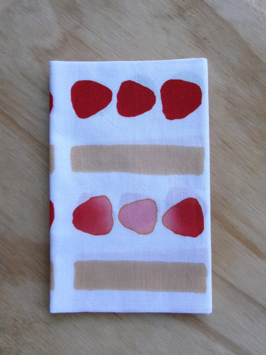 Japanese tenugui towel featuring colorful fruit sandwich pattern by Kamawanu, showcasing traditional fabric design.