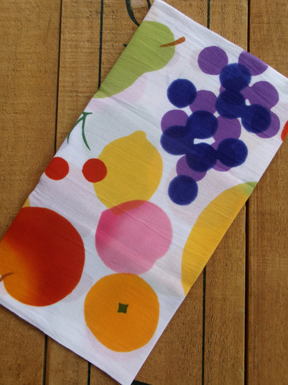 Japanese tenugui cloth with colorful fruit prints by Kamawanu, featuring vibrant illustrations of various fruits on traditional fabric.